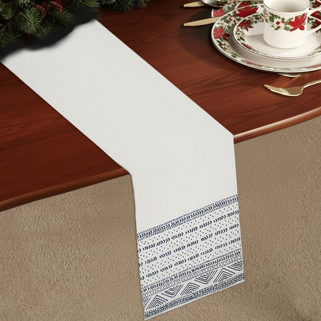 Cream cotton tablerunner with tribal indigo embroidery on both ends, inspired by Inca textile motifs